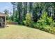 Large backyard featuring lush lawn and mature trees at 53 Azul Dr, Clayton, NC 27520
