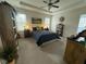 Spacious bedroom with ample natural light, tray ceilings, and comfortable furnishings at 53 Azul Dr, Clayton, NC 27520