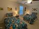 Bedroom with two beds, a ceiling fan, and unique decorative wall art and accents at 53 Azul Dr, Clayton, NC 27520