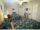 Cozy bedroom with unique bedding, ceiling fan, and decor, featuring a bright window at 53 Azul Dr, Clayton, NC 27520