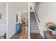 Open entryway with hardwood floors leading into a living space with an adjacent staircase at 53 Azul Dr, Clayton, NC 27520