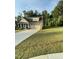 Beautifully maintained lawn of a home with stone accents and an attached two car garage at 53 Azul Dr, Clayton, NC 27520