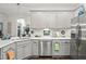 Modern kitchen showcasing stainless steel appliances, including a dishwasher and refrigerator at 53 Azul Dr, Clayton, NC 27520