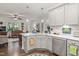 Well-lit kitchen with stainless steel dishwasher and white countertops adjacent to open living space at 53 Azul Dr, Clayton, NC 27520