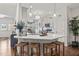 Bright kitchen features light countertops, pendant lighting, and stainless steel refrigerator at 53 Azul Dr, Clayton, NC 27520