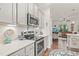Charming kitchen with stainless steel oven, microwave, and light gray cabinetry at 53 Azul Dr, Clayton, NC 27520