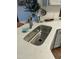 Close-up of modern kitchen sink and quartz countertop at 53 Azul Dr, Clayton, NC 27520