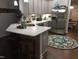 Open kitchen boasts a stainless steel refrigerator, modern cabinetry, and light countertops at 53 Azul Dr, Clayton, NC 27520