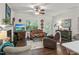 Inviting living room with ceiling fan, fireplace, and comfortable seating arrangements at 53 Azul Dr, Clayton, NC 27520