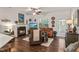 Bright living area boasts a fireplace, ceiling fan, and access to outdoor area at 53 Azul Dr, Clayton, NC 27520