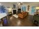 Spacious living room with a fireplace, comfortable seating, and hardwood floors at 53 Azul Dr, Clayton, NC 27520