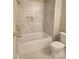 Bright bathroom showcasing a tiled shower with a built-in niche and modern fixtures at 5480 Thom Rd, Mebane, NC 27302
