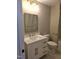 Stylish bathroom featuring a white vanity with a marble countertop and modern gold fixtures at 5480 Thom Rd, Mebane, NC 27302