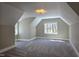 Spacious bedroom with vaulted ceilings, soft carpet, and natural light through ample windows at 5480 Thom Rd, Mebane, NC 27302