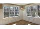 The dining area features large windows allowing natural light and beautiful views and decorative wainscoting at 5480 Thom Rd, Mebane, NC 27302