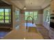 Bright, modern kitchen featuring a center island with quartz countertops, stainless appliances and hardwood floors at 5480 Thom Rd, Mebane, NC 27302