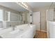 Bright bathroom with double sinks, full mirror, separate glass door shower and tub at 5604 Stardust Dr, Durham, NC 27712