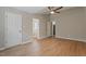 Large bedroom with ceiling fan and views to en-suite bathroom at 5604 Stardust Dr, Durham, NC 27712