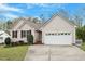 Charming single-story home with a two-car garage, neutral siding and professional landscaping at 5604 Stardust Dr, Durham, NC 27712