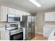 Modern kitchen showcases stainless steel appliances and ample cabinet space at 5604 Stardust Dr, Durham, NC 27712