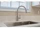 Close up of the kitchen sink, faucet, and countertop at 5604 Stardust Dr, Durham, NC 27712