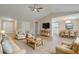 Cozy living room with vaulted ceilings, ceiling fan, comfortable seating, light hardwood flooring, and access to kitchen at 5604 Stardust Dr, Durham, NC 27712