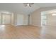 Spacious open-concept living room with light-colored wood floors, and access to kitchen at 5604 Stardust Dr, Durham, NC 27712