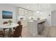 Charming kitchenette features an island with seating, a stylish table, and modern appliances for convenience at 570 Freedom Trail Dr, Willow Springs, NC 27592