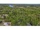 Aerial view showcasing the vast land, mature trees, and quiet rural setting at 5864 Whitney Rd, Graham, NC 27253