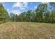 Large lot featuring a spacious yard and two sheds at 5864 Whitney Rd, Graham, NC 27253