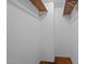Walk-in closet offering wood floors and shelves at 5864 Whitney Rd, Graham, NC 27253