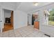 Dining area with tile flooring, open to kitchen and access to living spaces at 5864 Whitney Rd, Graham, NC 27253
