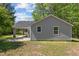 Side view of the home with a driveway and ample yard space at 5864 Whitney Rd, Graham, NC 27253