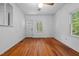 Bright living room featuring hardwood floors and a window with natural light at 5864 Whitney Rd, Graham, NC 27253
