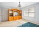 Bedroom with a large wooden shelving unit and a large window at 702 Orange Ct, Elon, NC 27244