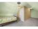 Bedroom featuring carpet, a bed, and sloped ceilings with a ceiling fan at 702 Orange Ct, Elon, NC 27244