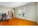 Bright bedroom with hardwood floors, a large window, and neutral walls at 702 Orange Ct, Elon, NC 27244
