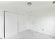 Bright bedroom featuring plush carpeting and a closet at 707 Obsidian Way, Durham, NC 27703