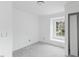 Bedroom boasts soft, neutral walls, plush carpeting, and a cozy window seat at 707 Obsidian Way, Durham, NC 27703