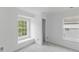 Cozy bedroom with windows and neutral carpet; a comfortable retreat at 707 Obsidian Way, Durham, NC 27703