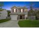 Charming two-story home featuring a well-manicured lawn and an attached single-car garage at 707 Obsidian Way, Durham, NC 27703