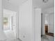 Upstairs hallway featuring neutral decor, a linen closet and access to rooms at 707 Obsidian Way, Durham, NC 27703