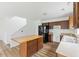 Kitchen showcases wood cabinets, stainless steel appliances, and functional kitchen island at 707 Obsidian Way, Durham, NC 27703