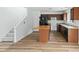 Charming kitchen with wood cabinets, black refrigerator, and island with butcher block top at 707 Obsidian Way, Durham, NC 27703