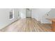 Bright living room boasts beautiful floors, neutral walls, and abundant natural light at 707 Obsidian Way, Durham, NC 27703