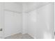 Bright walk-in closet with white walls, carpeted floor, and built in white-wire shelving at 707 Obsidian Way, Durham, NC 27703
