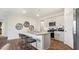 Modern kitchen with granite countertops, stainless steel appliances, and stylish bar seating for a contemporary living experience at 712 Holstein Dairy Way, Wake Forest, NC 27587