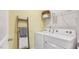 Laundry room featuring a side-by-side washer and dryer, plus a ladder with throws and a shelf at 712 Holstein Dairy Way, Wake Forest, NC 27587