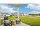 Covered patio with outdoor seating overlooking the backyard at 712 Holstein Dairy Way, Wake Forest, NC 27587