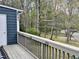 Open back porch offering a view of the wooded backyard at 7429 Ashbury Ct, Raleigh, NC 27615